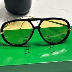 Bottega Veneta Black Frame Sunglasses with Yellow Lenses